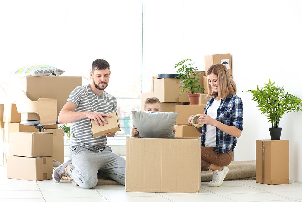 A Family is Moving Into a New Home — Port Stephens Removals & Storage In Salt Ash, NSW
