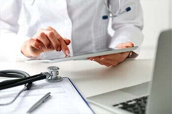 Female doctor hold digital tablet - Physical Test in Salina, KS