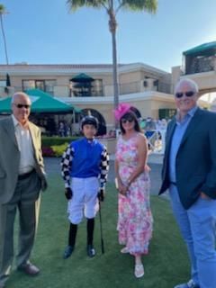 A group of people standing in front of a building