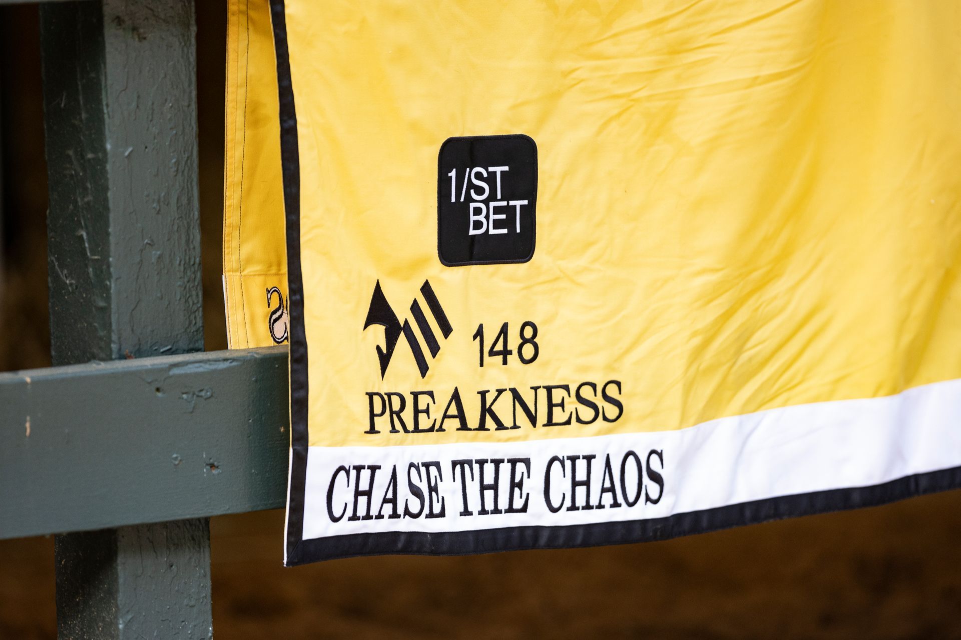 A yellow blanket with the words chase the chaos on it