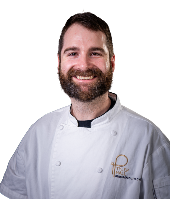 A headshot of Chef Tyler Hall