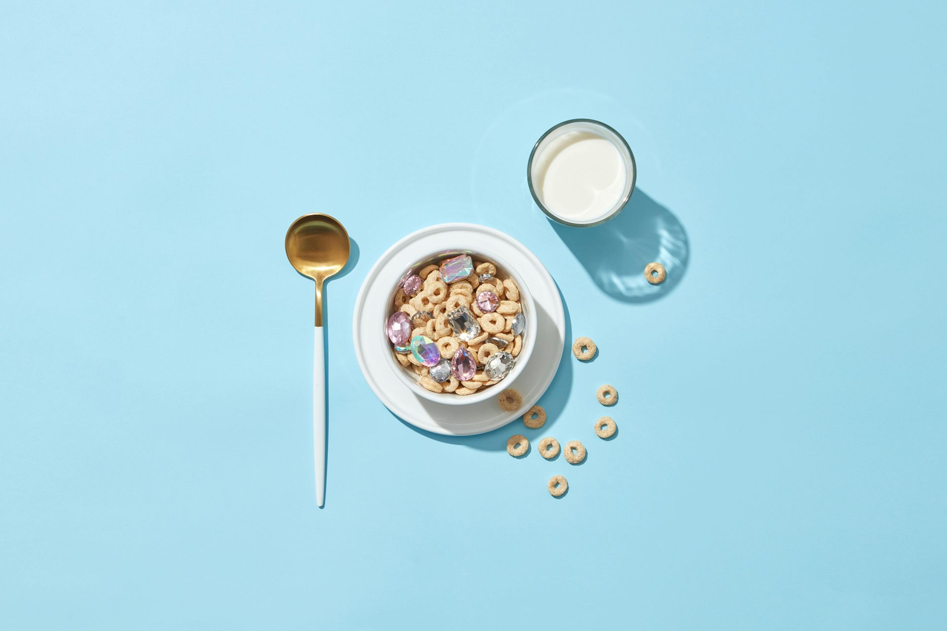 Bowl of cereal, glass of milk, and a spoon