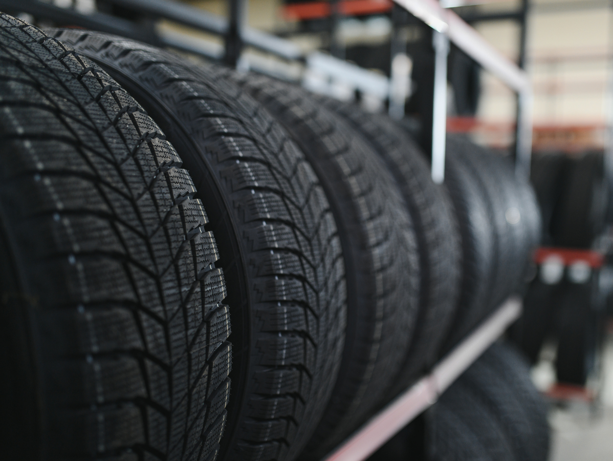 Tires lined up on a shelf, showcasing the tread pattern.