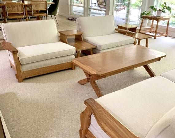 A living room with chairs and a coffee table