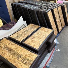 A bunch of mattresses are stacked on top of each other