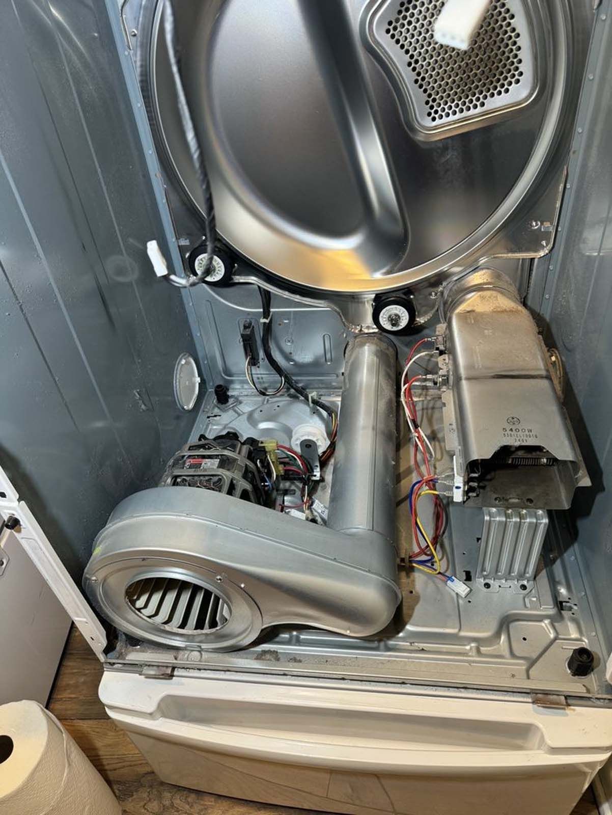 The inside of a dryer is shown with the door open.