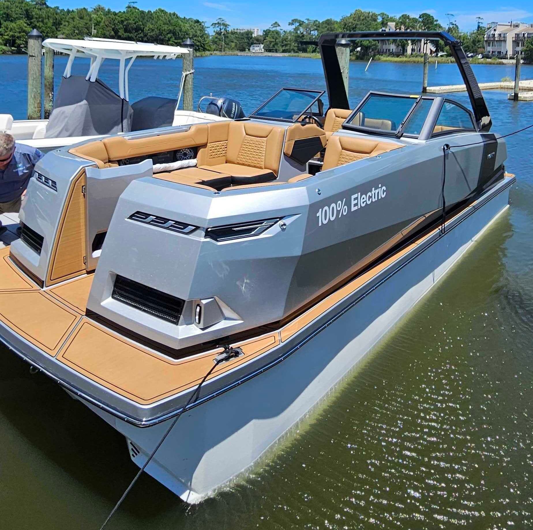 Ingenity boat with 2 ladies on the back transom 