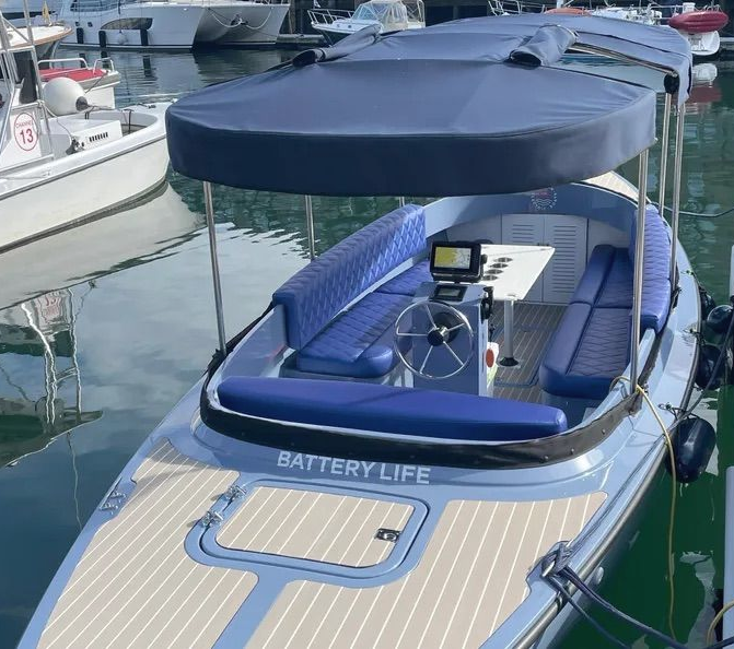 Fantail 217 All blue in water, captain seat at stern, vision marine electric boat, battery life