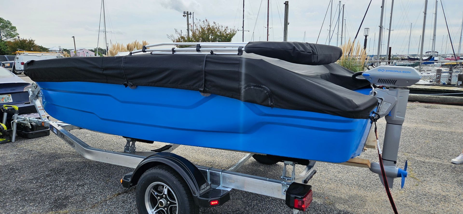 Blue Phantom plastic boat with cover - side back