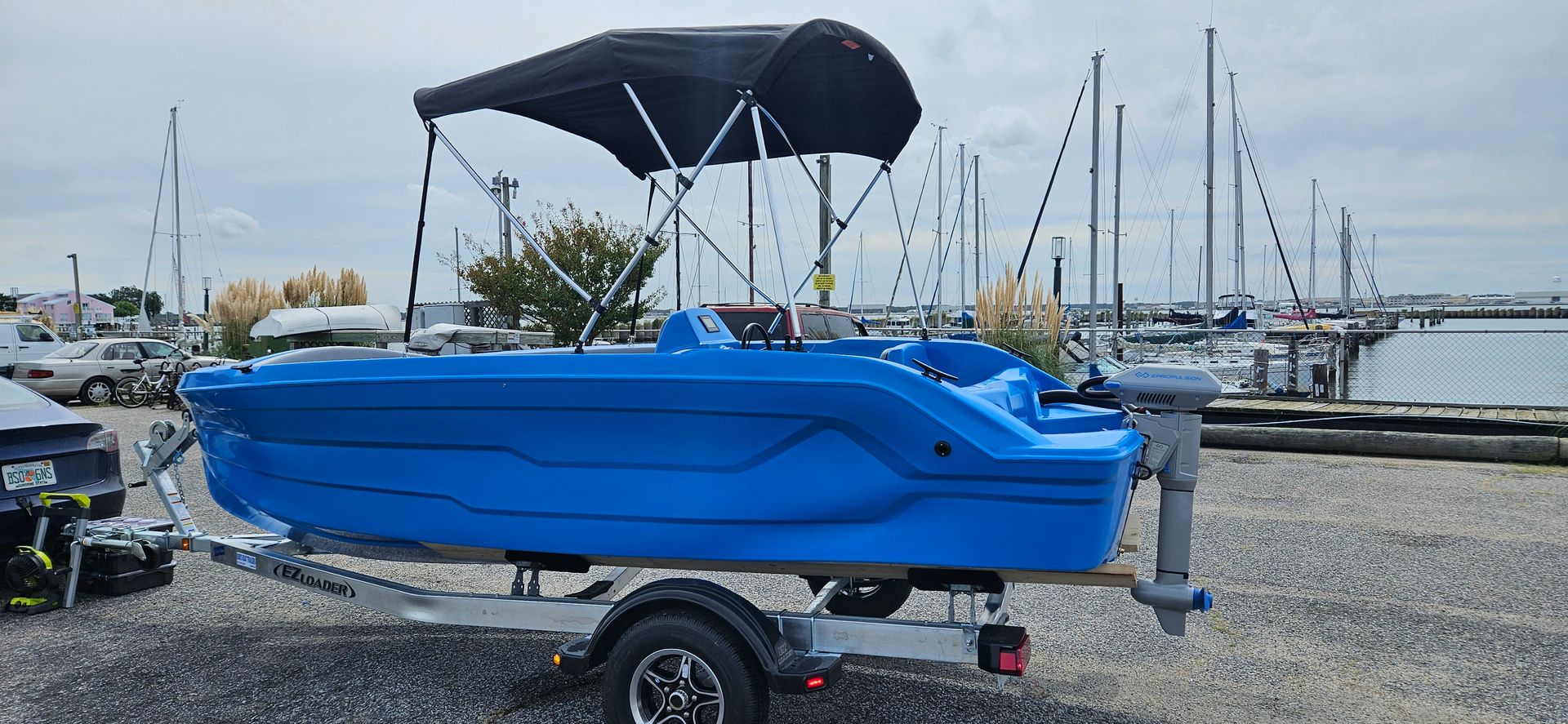 Blue Phantom plastic boat with canopy top - back side