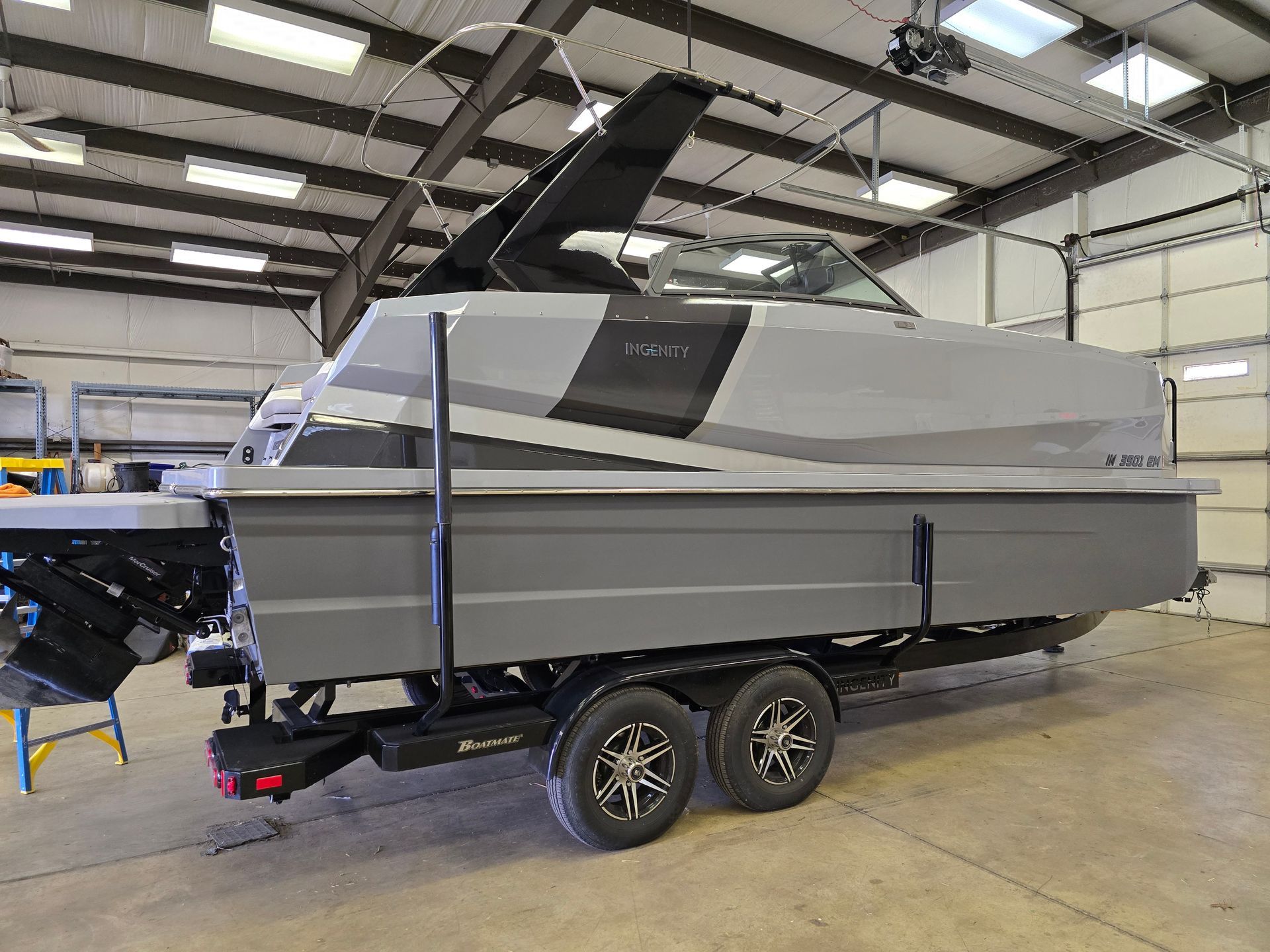 Gray Ingenity 23e boat with on trailer - sb back