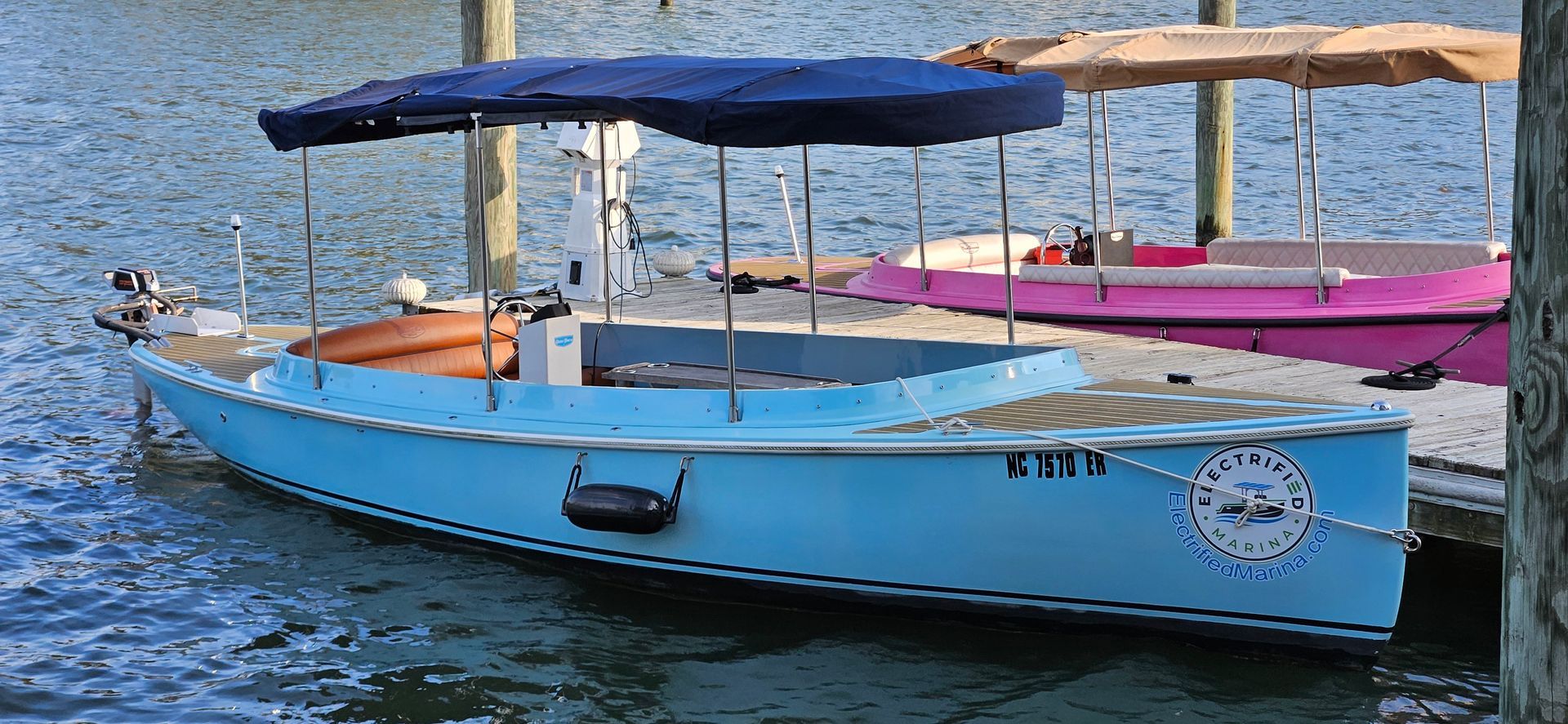 Blue Fantail boat with blue canopy top - Front side sb