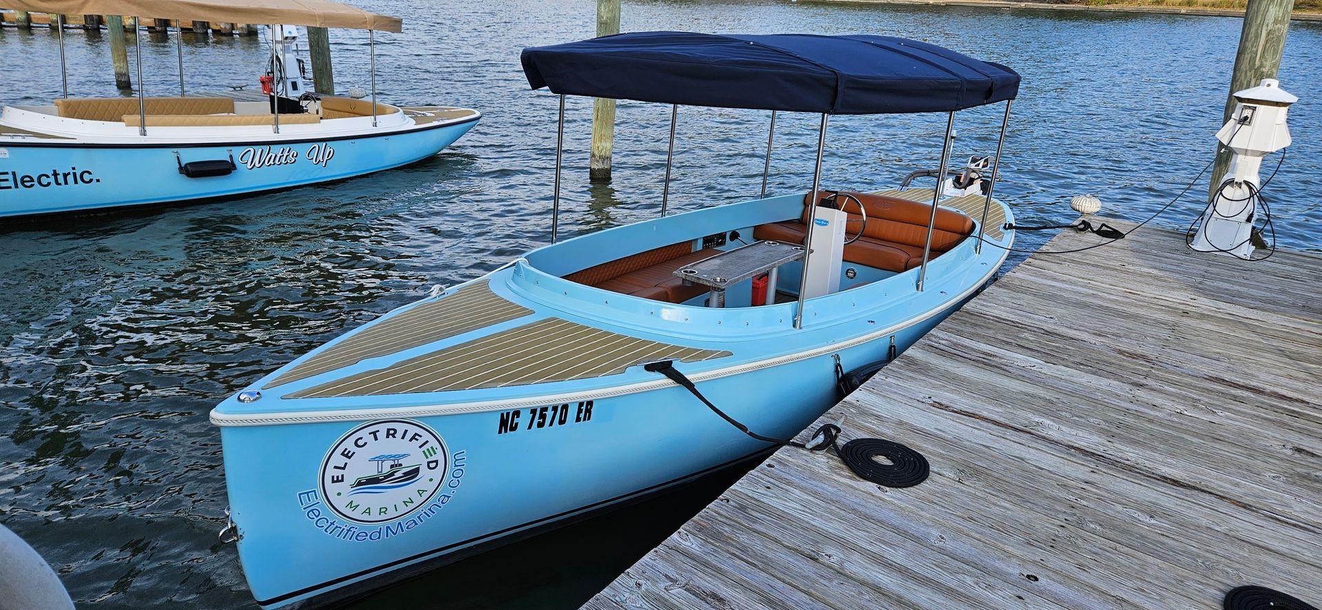 Blue Fantail boat with blue canopy top - Front side