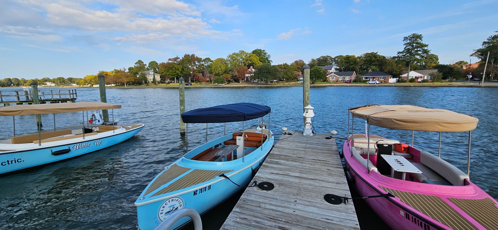 Blue Fantail boat with blue canopy top - with other fantail boats