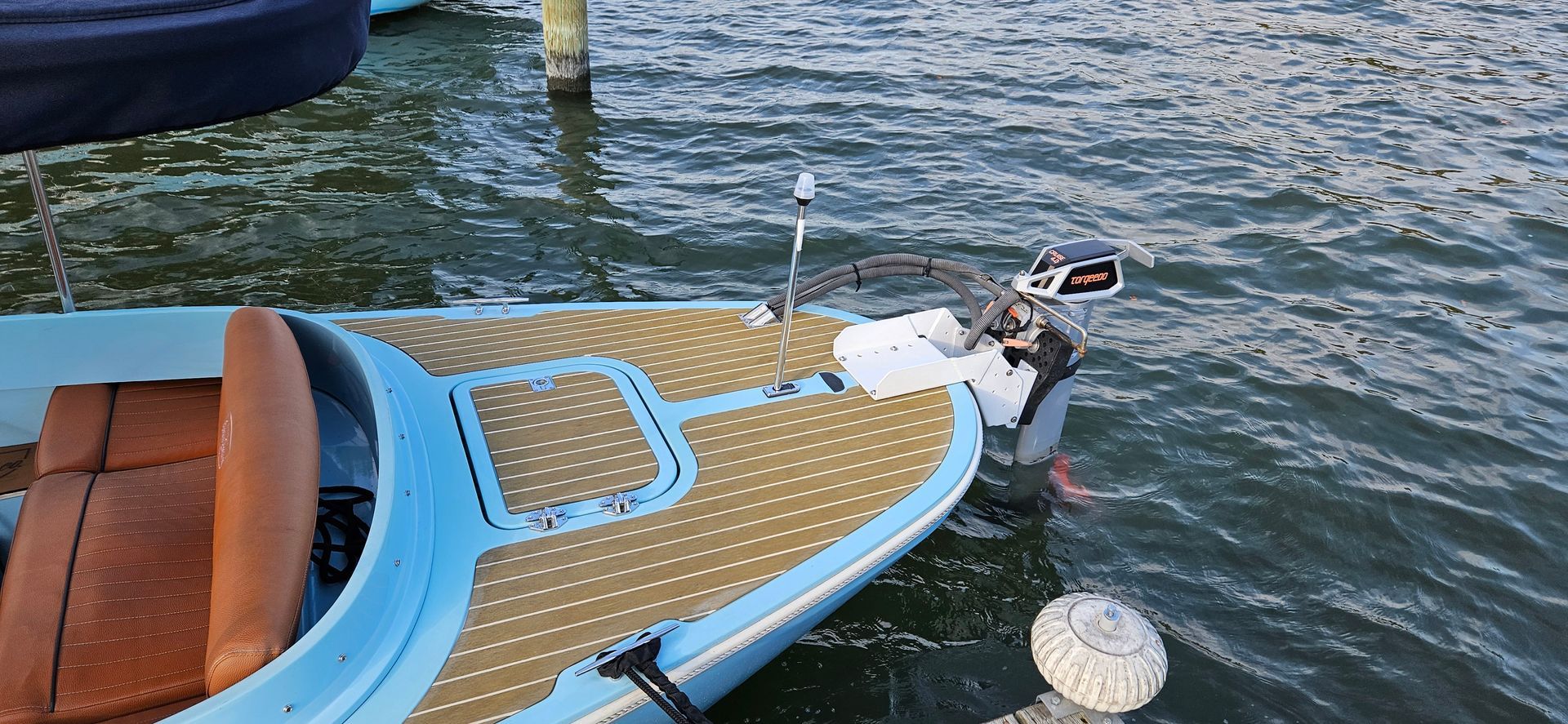 Blue Fantail boat with blue canopy top - motor