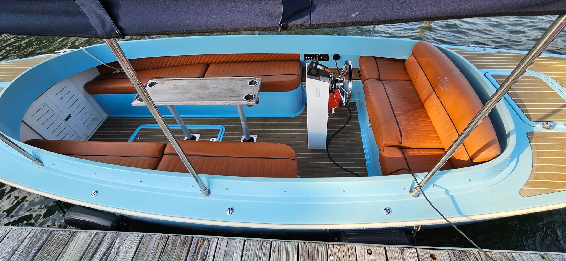 Blue Fantail boat with blue canopy top - seating