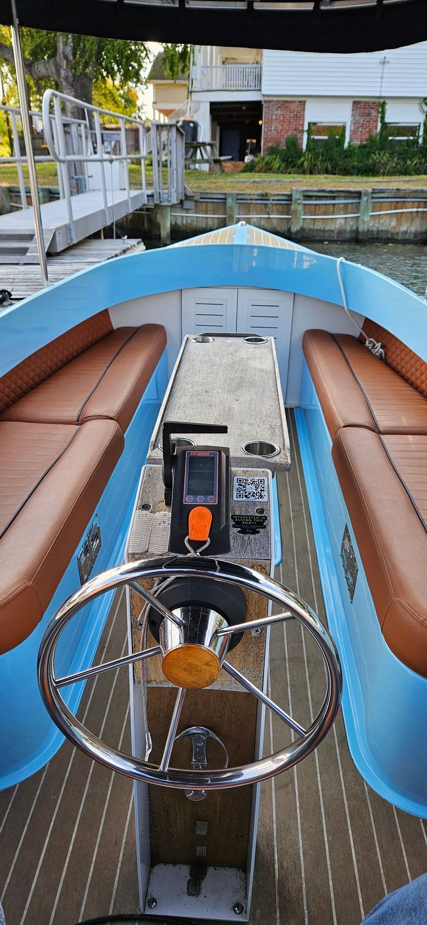 Blue Fantail boat with blue canopy top - throttle