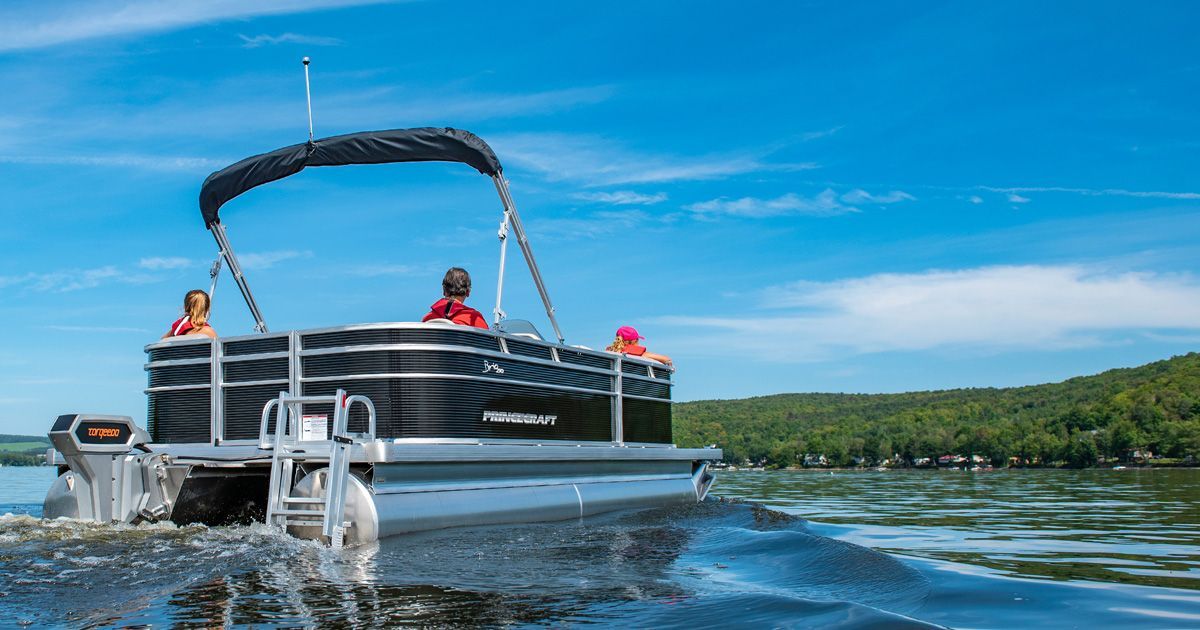 Ingenity boat with 2 ladies on the back transom 