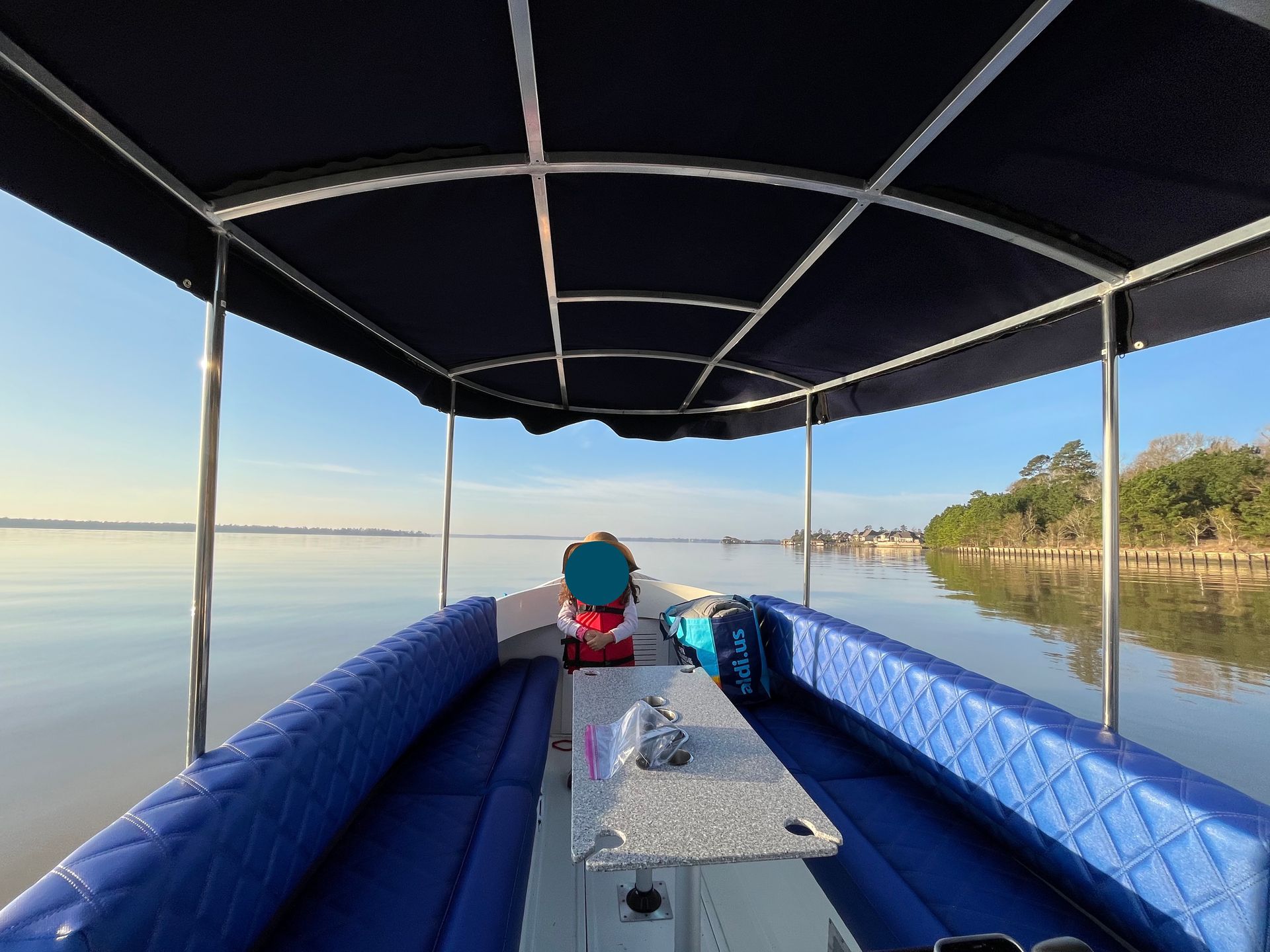Interior of electric gondala style boat Fantail 215 royal blue interior and table set up