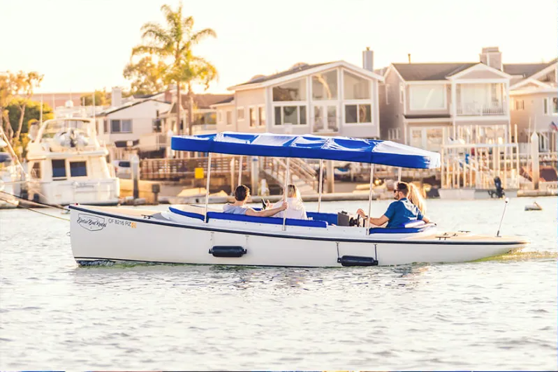 Family in Fantail 217 cruising through waterway