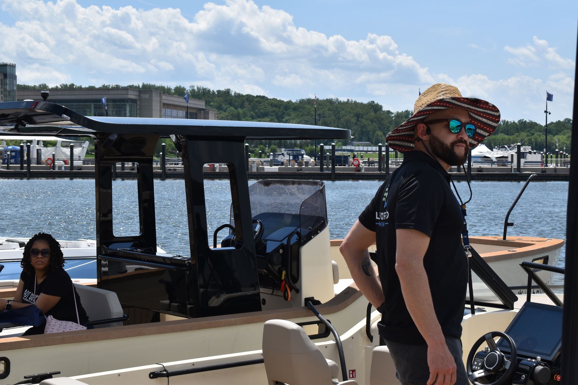 A couple of boats are docked at a marina.