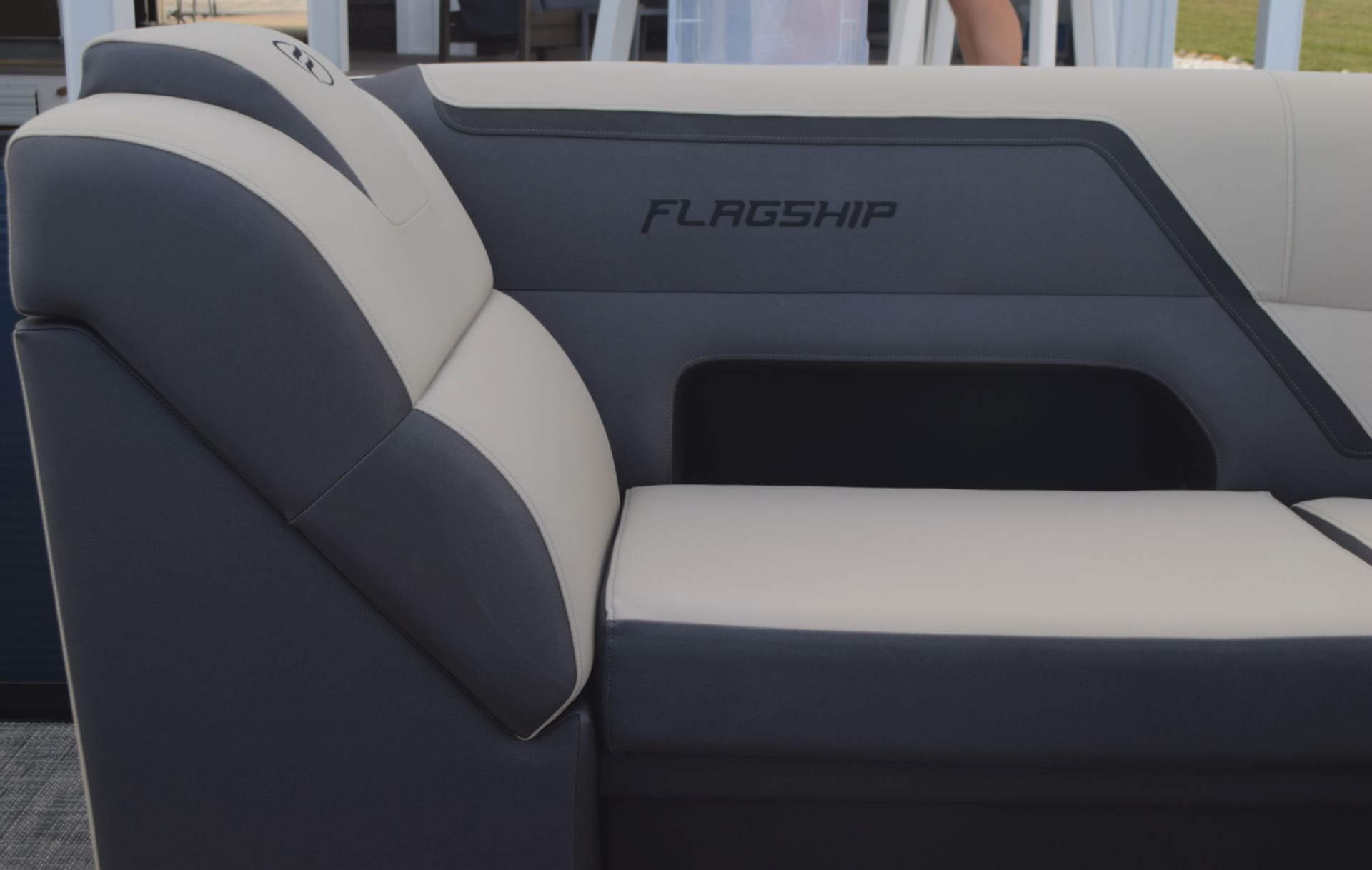 sunbed on Flagship Discover pontoon charcoal and light grey seats