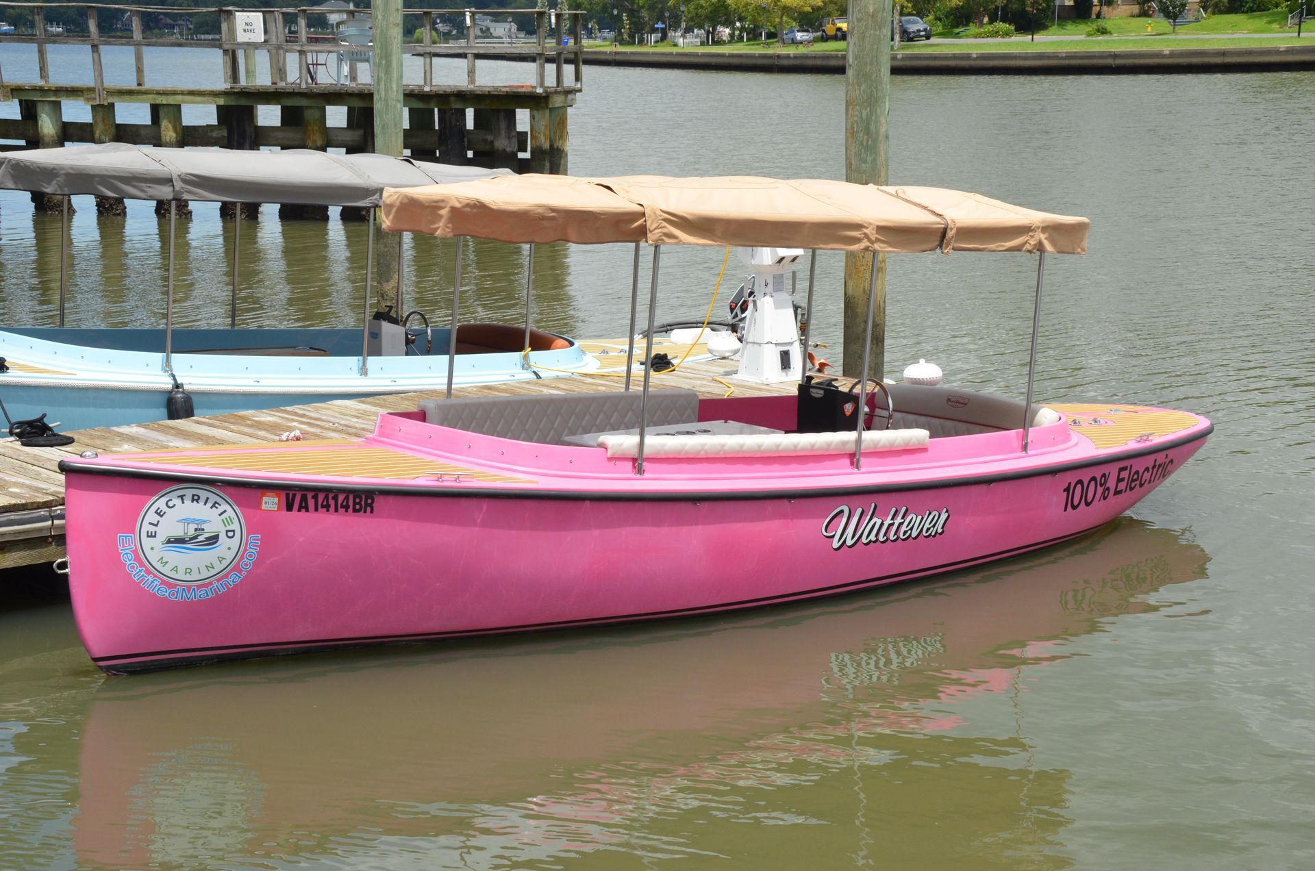 Pink Fantail boat with canopy top - side