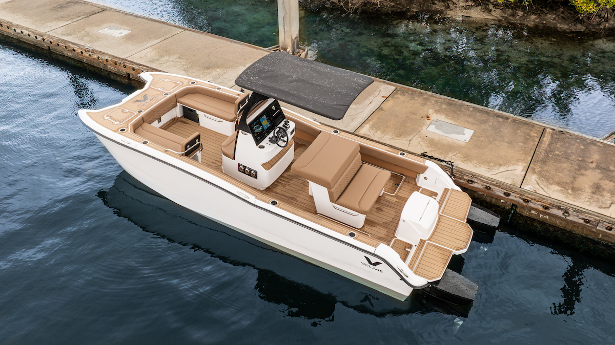 Artemis 23 electric boat from Volare center console boat next to a dock