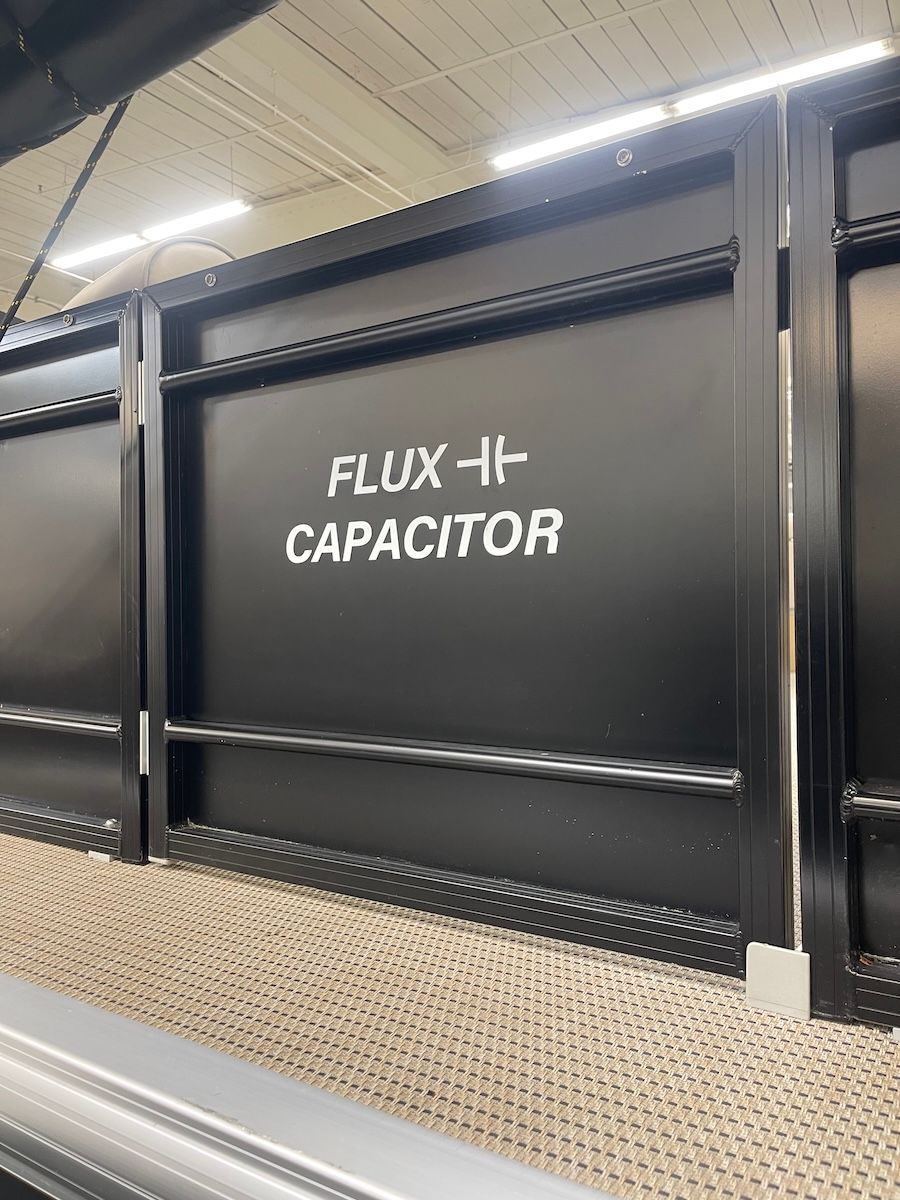 Gate on pontoon that has Flux Capacitor written on the side