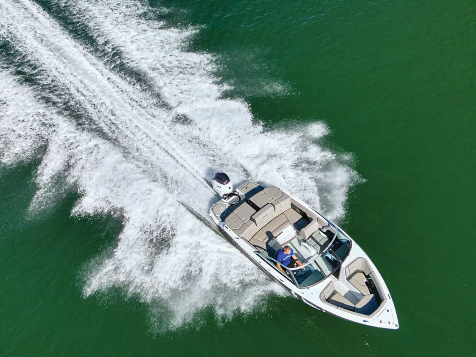 H2e four winns bowrider electric boat speeding through water