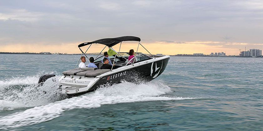 Ingenity boat with 2 ladies on the back transom 
