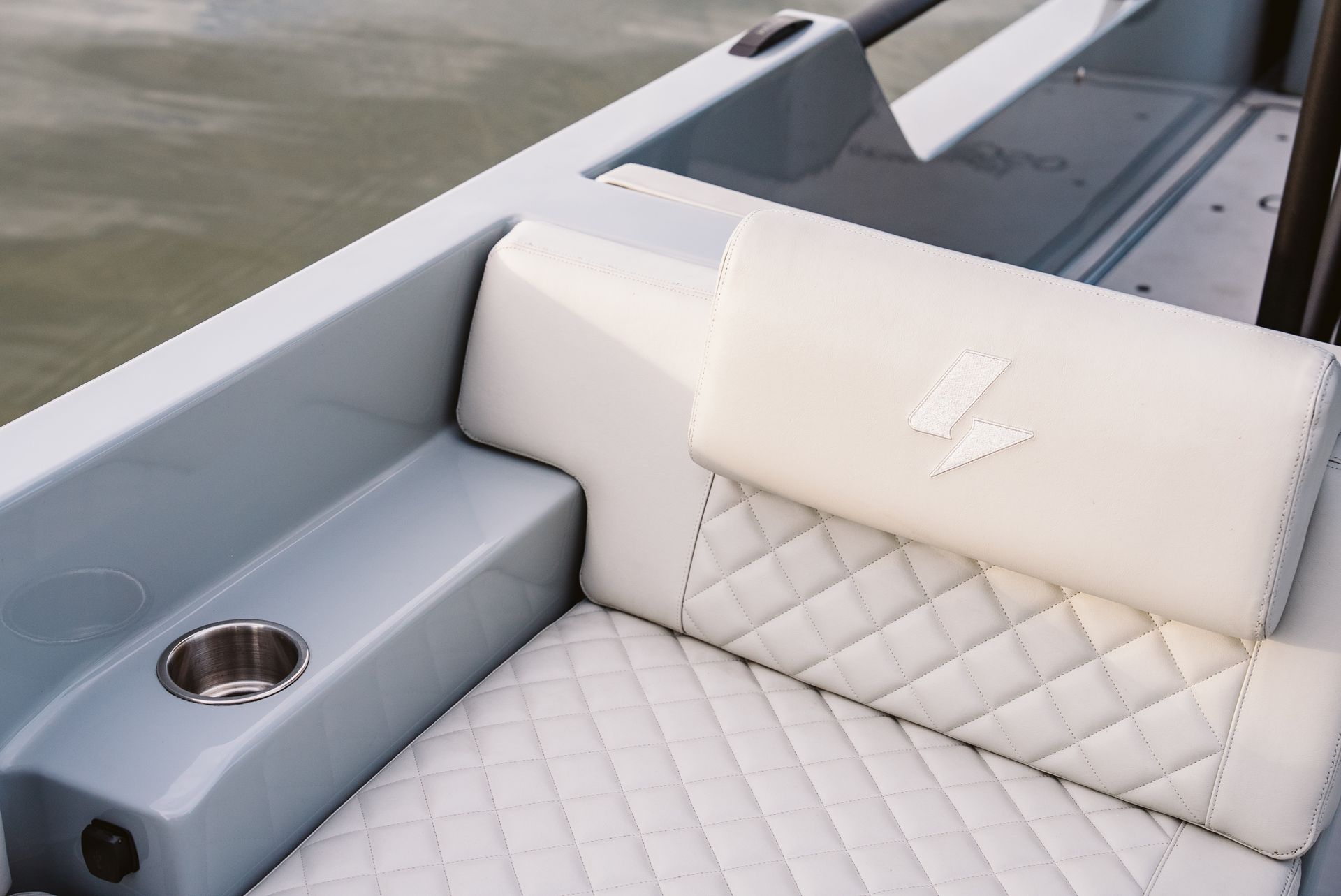 Halevai close up of seat on starboard side on bow of boat cream seats and grey interior