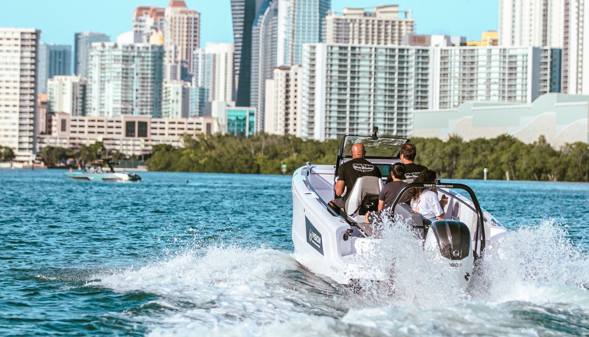 Ingenity boat with 2 ladies on the back transom 