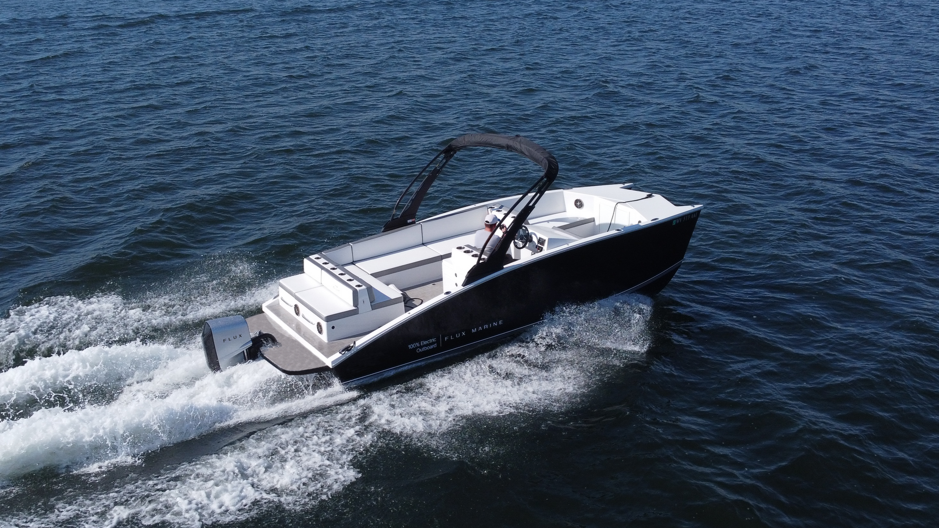 GFX Catamaran from Flux marina electric outboard in water at planning speeds