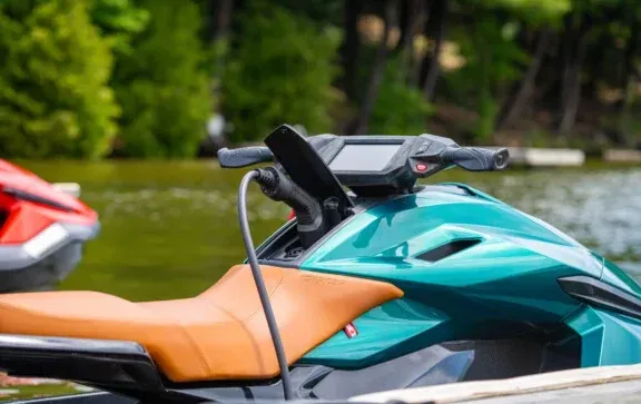 Teal Taiga Orca 100% electric personal watercraft PWC Jet Ski charging in water 