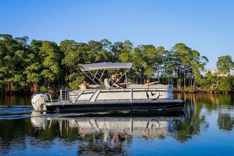 Vision Marine 24 foot electric pontoon in water