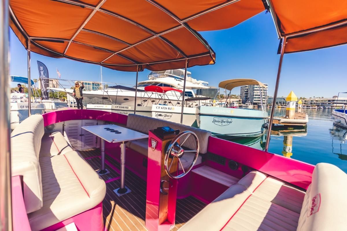 Pink Fantail boat with canopy top - seating