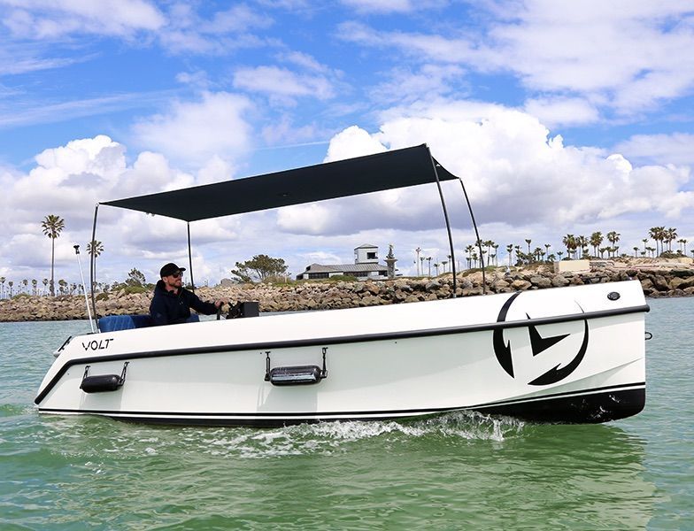 White Vision Marine volt with full canopy display in water man on boat