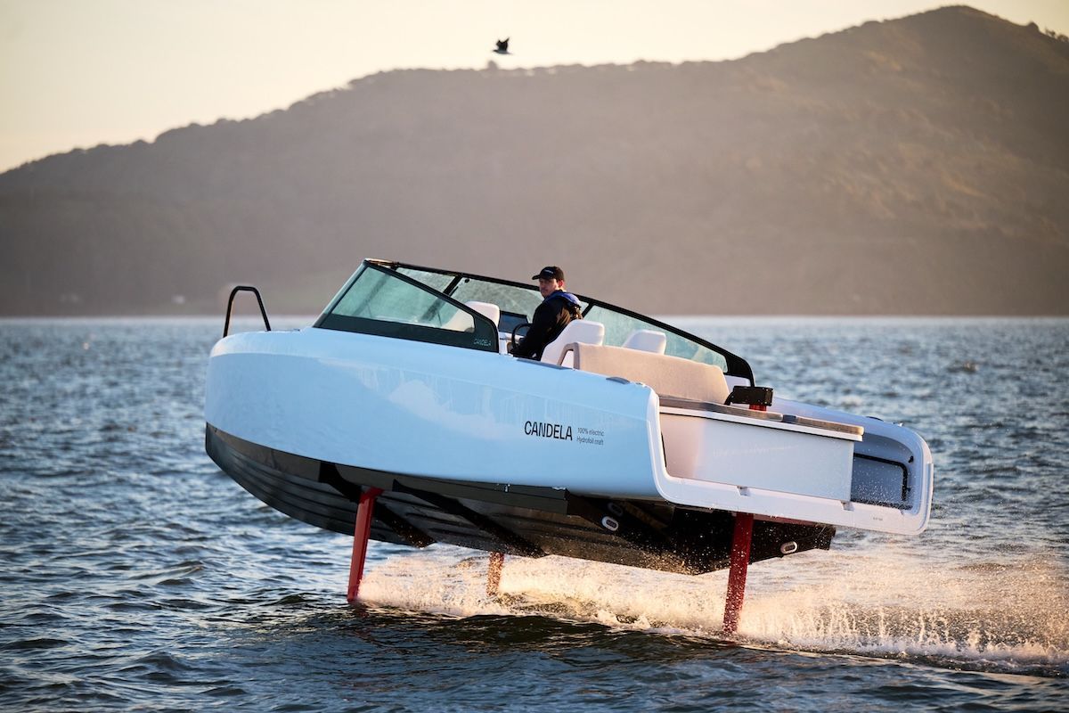 Candela hydro-foil boat fully electric flying through water