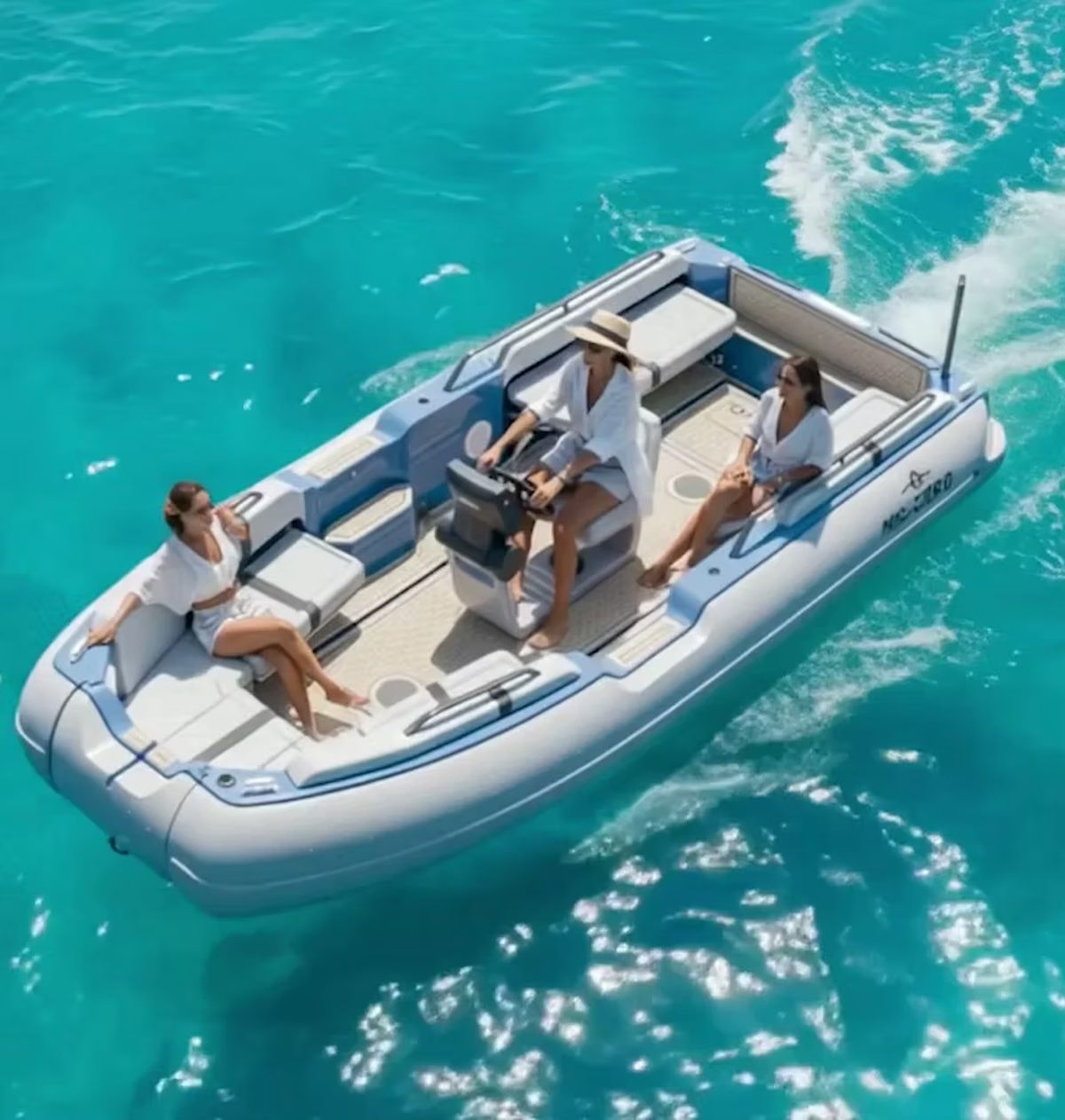 Female riding the ZeroJet Powered OC tender  in the ocean