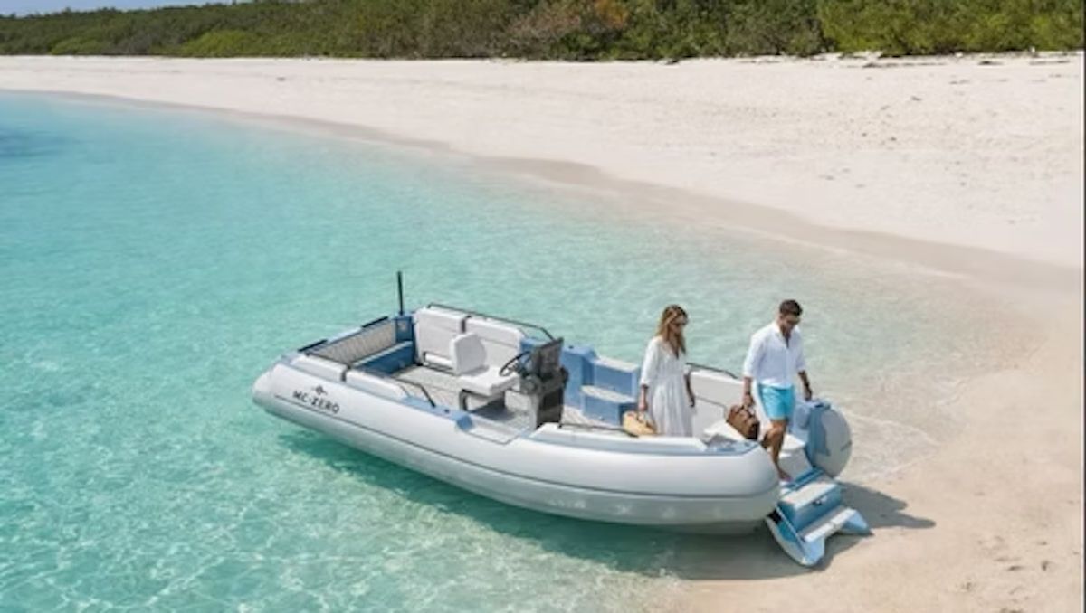 Couples riding the ZeroJet Powered OC tender  in the ocean