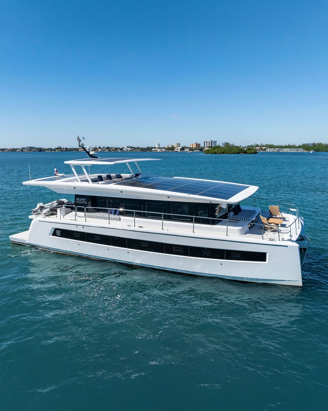 side view of silent electric 62 foot yacht in water 