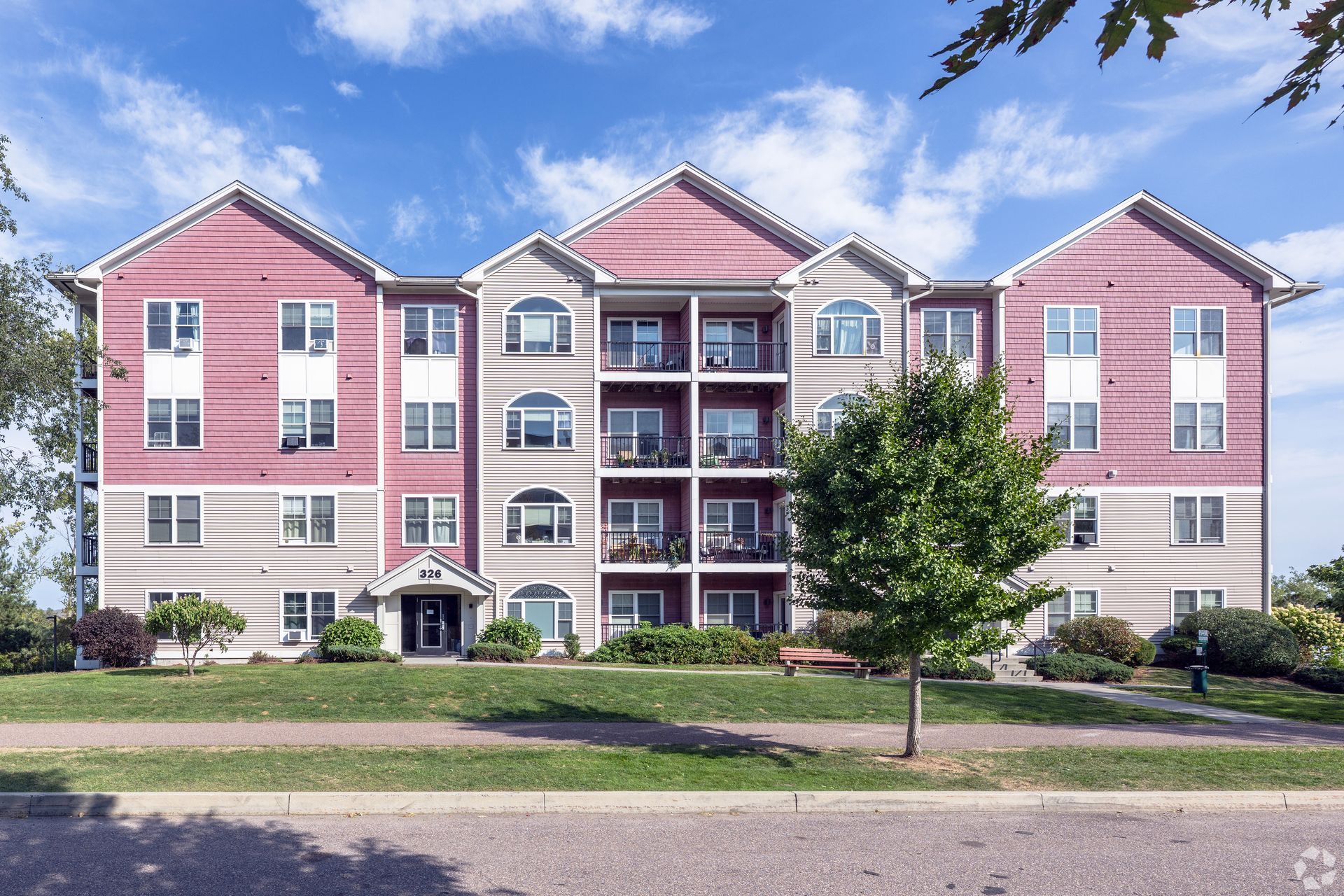 A large apartment building with a lot of windows