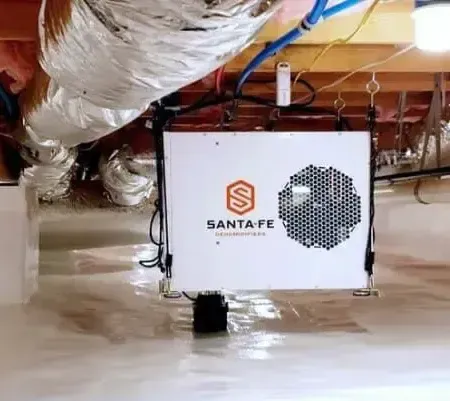 A santa fe sign is hanging from the ceiling of a room.