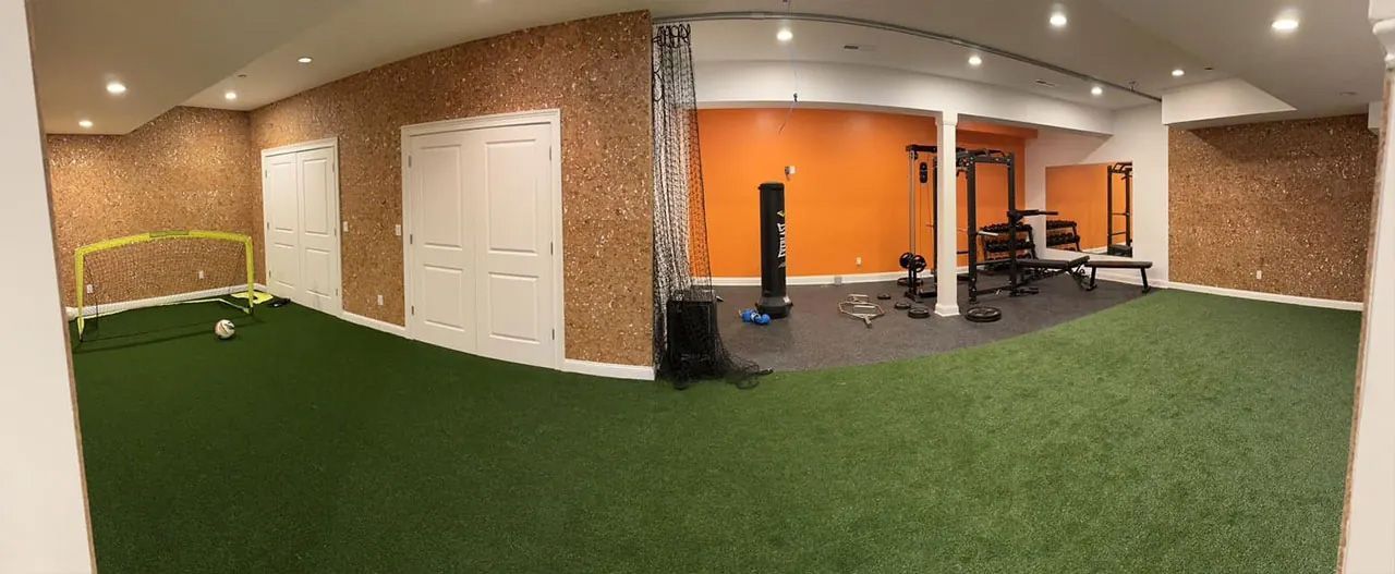 A large room with a lot of exercise equipment in it.