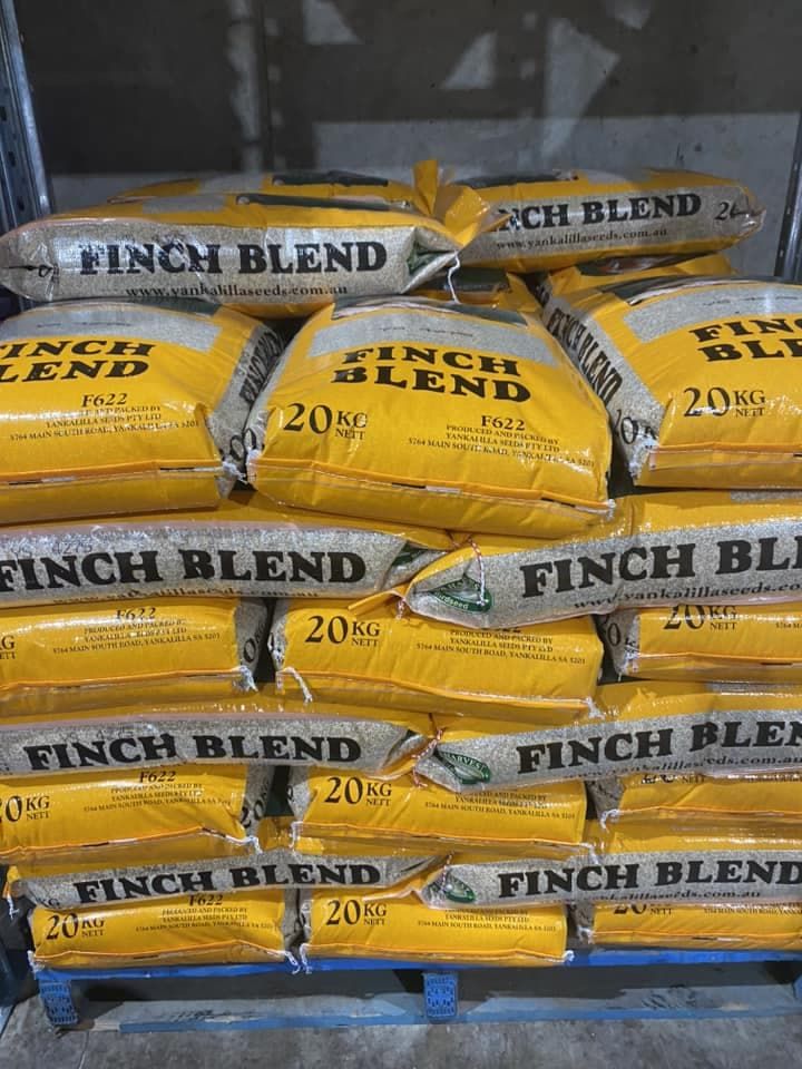 A Bunch of Bags of Finch Blend Are Stacked on Top of Each Other — Territory Stock Feed & Saddlery in Alice Springs, NT 
