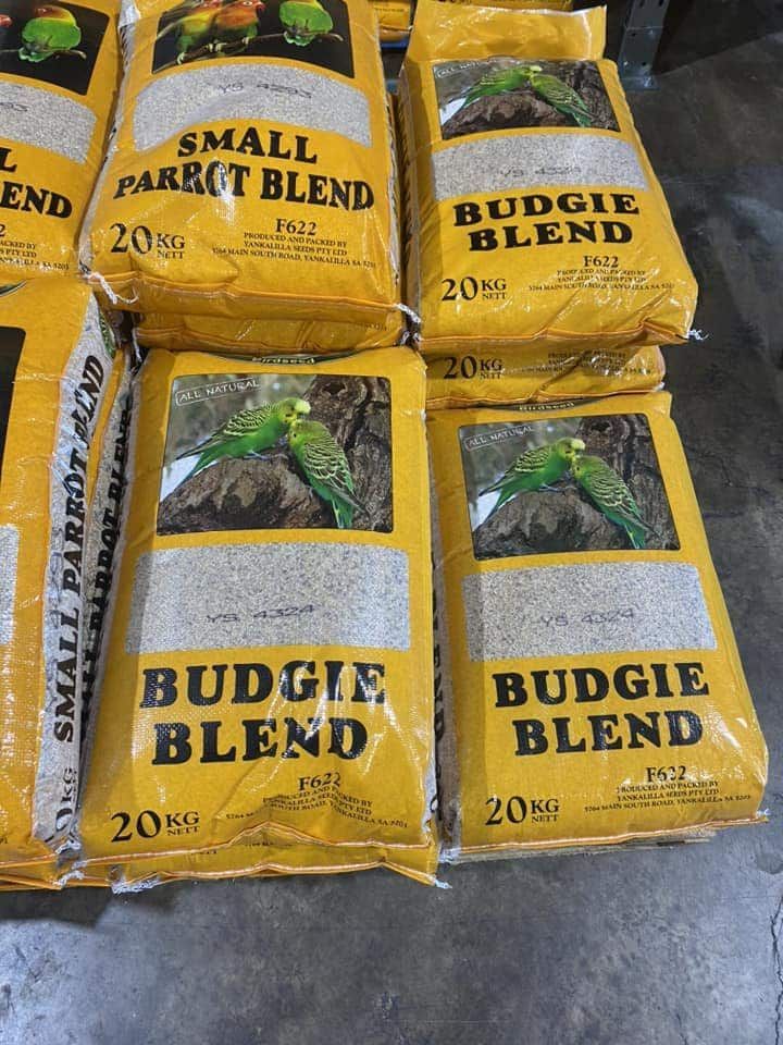 A Bunch of Bags of Budgie Blend Are Stacked on Top — Territory Stock Feed & Saddlery in Alice Springs, NT 
