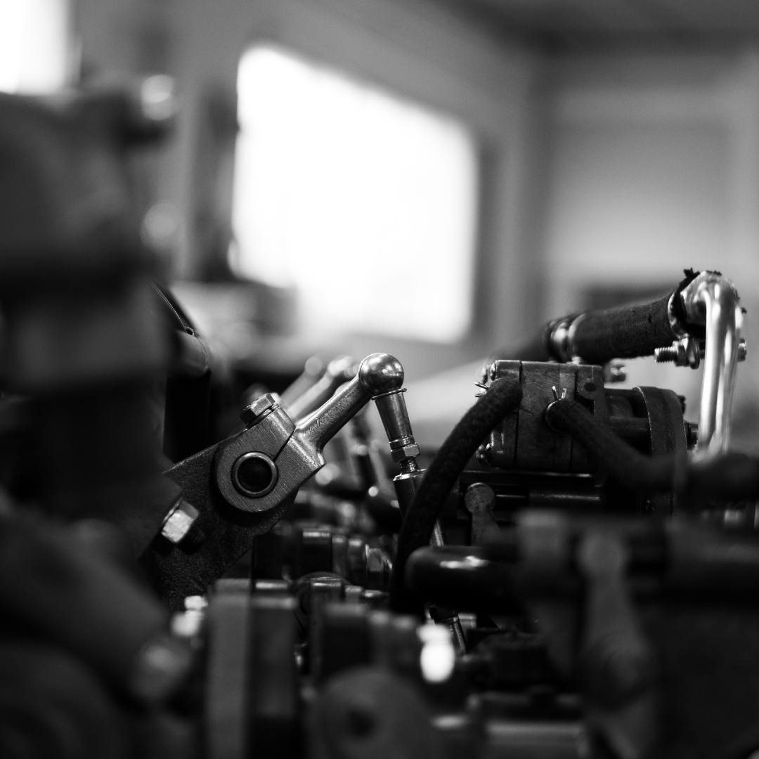 A black and white photo of a machine in a factory