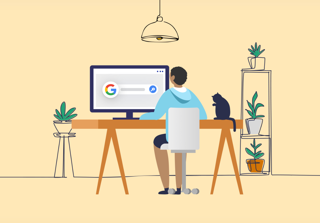 a man is sitting at a desk with a computer searching on Google and a cat .