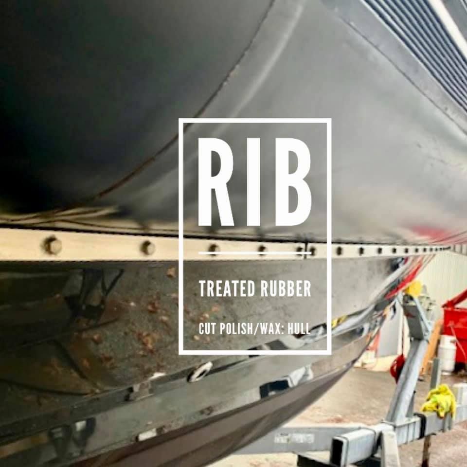 A black RIB (Rigid Inflatable Boat) with text overlay